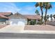 Charming single-story home with a two-car garage and a well-maintained front yard with palm trees at 118 Westin Ln, Henderson, NV 89002