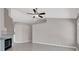 Open floor plan featuring a tile floor, ceiling fan and fireplace at 118 Westin Ln, Henderson, NV 89002