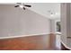 Spacious living room boasts vaulted ceilings, stylish ceiling fan, and rich hardwood floors at 118 Westin Ln, Henderson, NV 89002