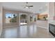 Bright living room with tile floors, sliding glass door and views to the kitchen at 118 Westin Ln, Henderson, NV 89002