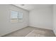 Carpeted bedroom with a bright window at 1701 Desert Path Ave, North Las Vegas, NV 89032