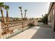 Balcony view featuring a jacuzzi and pool with tall palm trees and a mountain view at 1811 Country Meadows Dr, Henderson, NV 89012