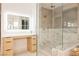 Luxurious bathroom with glass shower, marble accents, modern vanity and a light up vanity mirror at 1811 Country Meadows Dr, Henderson, NV 89012