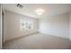 Bright bedroom featuring neutral carpet and a large window offering natural light at 1811 Country Meadows Dr, Henderson, NV 89012