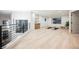 Bright bonus room with light wood floors, dry bar, yoga mats, and a comfortable sitting chair at 1811 Country Meadows Dr, Henderson, NV 89012