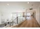 Bright upstairs hallway with modern railings, abundant natural light, and spacious design at 1811 Country Meadows Dr, Henderson, NV 89012