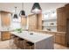Spacious kitchen featuring a marble island with seating and modern stainless steel appliances at 1811 Country Meadows Dr, Henderson, NV 89012