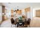 Bright kitchen with large island, modern light fixtures, and dining area at 1811 Country Meadows Dr, Henderson, NV 89012