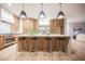 Well-lit kitchen features a spacious island, stainless steel appliances, and ample storage at 1811 Country Meadows Dr, Henderson, NV 89012