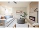 Cozy living room with a modern fireplace, comfortable sofa, and stylish decor at 1811 Country Meadows Dr, Henderson, NV 89012