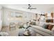 Bright living room with large windows, comfortable seating, and open-concept design at 1811 Country Meadows Dr, Henderson, NV 89012