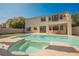 Backyard pool area with patio, upper balcony, and partial view of the rear exterior at 1811 Country Meadows Dr, Henderson, NV 89012