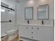Bright bathroom featuring double vanity, modern fixtures, and updated shower at 1852 E Viking Rd, Las Vegas, NV 89169