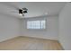 Bright bedroom with light floors, neutral walls, and large window at 1852 E Viking Rd, Las Vegas, NV 89169