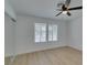 Bright bedroom featuring a ceiling fan, light wood floors, and closet with sliding doors at 1852 E Viking Rd, Las Vegas, NV 89169