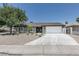 Charming single-story home with a well-maintained lawn and a spacious two-car garage, offering both style and functionality at 1852 E Viking Rd, Las Vegas, NV 89169