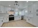 Modern kitchen with white cabinets, quartz countertops, and stainless steel appliances, offering both style and functionality at 1852 E Viking Rd, Las Vegas, NV 89169
