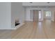 Bright living room featuring a brick fireplace and light wood floors at 1852 E Viking Rd, Las Vegas, NV 89169