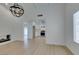 Open living room with a brick fireplace flowing into the kitchen area at 1852 E Viking Rd, Las Vegas, NV 89169
