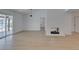 Bright open living area featuring wood floors, fireplace, and sliding glass doors at 1852 E Viking Rd, Las Vegas, NV 89169