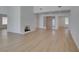 Bright living room features a fireplace, hardwood floors, and front entry door at 1852 E Viking Rd, Las Vegas, NV 89169