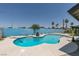 Beautiful kidney shaped pool with blue accent wall and meticulously designed landscape at 1852 E Viking Rd, Las Vegas, NV 89169