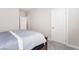 Cozy bedroom with blue bedding, plush carpet, and ample natural light at 19 Cresta Villa Ct, Henderson, NV 89011