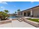 A sparkling pool with a covered patio offers a perfect outdoor retreat at 1950 Colvin Run Dr, Henderson, NV 89052