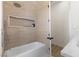 Well-designed bathroom with a tiled bathtub, a built-in shower niche, and modern fixtures for a relaxing experience at 1950 Colvin Run Dr, Henderson, NV 89052