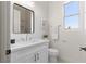 Bright bathroom with a modern vanity, a window for natural light, and sleek fixtures creating a clean and inviting space at 1950 Colvin Run Dr, Henderson, NV 89052