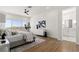 Spacious bedroom with a large window offering scenic views, complemented by stylish decor and natural light at 1950 Colvin Run Dr, Henderson, NV 89052