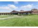 Well-maintained clubhouse on a lush green lawn with beautiful landscaping at 1950 Colvin Run Dr, Henderson, NV 89052