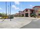 Community entrance with flags and desert landscaping for a welcoming approach at 1950 Colvin Run Dr, Henderson, NV 89052