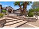 A charming home with stone accents, mature landscaping, and a welcoming entrance at 1950 Colvin Run Dr, Henderson, NV 89052