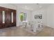 Elegant foyer with a stylish rug, modern furniture, and an eye-catching front door at 1950 Colvin Run Dr, Henderson, NV 89052