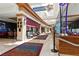Bright hallway with storefronts and comfortable seating areas for residents at 1950 Colvin Run Dr, Henderson, NV 89052