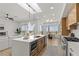 Modern, open kitchen featuring a large island, stainless steel appliances, and a seamless flow to the living area at 1950 Colvin Run Dr, Henderson, NV 89052