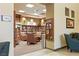 A cozy library with a variety of books, comfortable seating and neutral color tones at 1950 Colvin Run Dr, Henderson, NV 89052