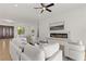 Living room featuring a fireplace, hardwood floors, and contemporary decor at 1950 Colvin Run Dr, Henderson, NV 89052