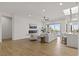 Bright living room with fireplace, hardwood floors, and sliding doors to the pool at 1950 Colvin Run Dr, Henderson, NV 89052