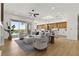 Open-concept living area flowing into a modern kitchen, with great views of the backyard pool and patio at 1950 Colvin Run Dr, Henderson, NV 89052