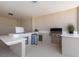 The covered outdoor kitchen is equipped with modern appliances and sleek countertops at 1950 Colvin Run Dr, Henderson, NV 89052