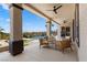 Covered patio seating area with a view of the pool and manicured grounds, perfect for relaxation at 1950 Colvin Run Dr, Henderson, NV 89052
