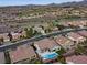 Aerial shot of a beautiful community with a home featuring a private pool and well-kept landscaping at 1999 Oliver Springs St, Henderson, NV 89052