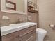Stylish powder bathroom showcasing modern fixtures, vanity and tiled walls at 1999 Oliver Springs St, Henderson, NV 89052