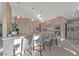 Elegant kitchen features a large island with seating and modern lighting fixtures at 1999 Oliver Springs St, Henderson, NV 89052