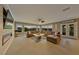 Large living room with a fireplace, huge sectional and beautiful outside views at 1999 Oliver Springs St, Henderson, NV 89052