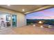 Gorgeous outdoor patio featuring a fire pit, pavers, and an amazing view of the city at 2069 Alto Vista Dr, Henderson, NV 89052