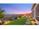 Beautiful backyard featuring a fire pit, artificial turf, desert landscaping and scenic views at 2069 Alto Vista Dr, Henderson, NV 89052