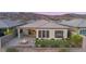 Aerial view of backyard with fire pit, pavers and artificial turf with seamless indoor-outdoor living at 2069 Alto Vista Dr, Henderson, NV 89052